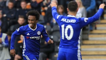 Chelsea's Brazilian midfielder Willian (L) celebrates after scoring the opening goal of the English Premier League football match between Hull City and Chelsea at the KCOM Stadium in Kingston upon Hull, north east England on October 1, 2016. / AFP / Lindsey PARNABY / RESTRICTED TO EDITORIAL USE. No use with unauthorized audio, video, data, fixture lists, club/league logos or 'live' services. Online in-match use limited to 75 images, no video emulation. No use in betting, games or single club/league/player publications. / (Photo credit should read LINDSEY PARNABY/AFP/Getty Images)