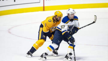 hhNASHVILLE, TN - NOVEMBER 21: David Perron #57 of the St. Louis Blues skates against Dan Hamhuis #5 of the Nashville Predators during a NHL game at Bridgestone Arena on November 21, 2018 in Nashville, Tennessee. (Photo by Ronald C. Modra/NHL/Getty Images)