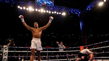 LONDON, ENGLAND - SEPTEMBER 22: Anthony Joshua celebrates victory over Alexander Povetkin during the IBF, WBA Super, WBO & IBO World Heavyweight Championship title fight between Anthony Joshua and Alexander Povetkin at Wembley Stadium on September 22, 2018 in London, England. (Photo by Richard Heathcote/Getty Images)