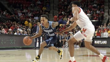 COLLEGE PARK, MD - NOVEMBER 09: Fatts Russell #1 of the Rhode Island Rams dribbles by Ricky Lindo Jr. #4 of the Maryland Terrapins during a basketball game at the Xfinity Center on November 9, 2019 in College Park, Maryland. (Photo by Mitchell Layton/Getty Images)