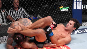 LAS VEGAS, NEVADA - APRIL 23: (R-L) Claudio Puelles of Peru works for a submission against Clay Guida in a lightweight fight during the UFC Fight Night event at UFC APEX on April 23, 2022 in Las Vegas, Nevada. (Photo by Jeff Bottari/Zuffa LLC)