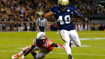 ATLANTA, GA - NOVEMBER 12: Clinton Lynch #49 of the Georgia Tech Yellow Jackets rushes for a touchdown against Brandon Facyson #31 of the Virginia Tech Hokies at Bobby Dodd Stadium on November 12, 2015 in Atlanta, Georgia. (Photo by Kevin C. Cox/Getty Images)