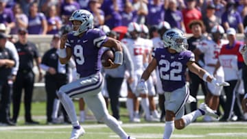 Adrian Martinez runs past running back Deuce Vaughn for a touchdown (Scott Sewell-USA TODAY Sports)