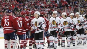 Jan 1, 2015; Washington, DC, USA; Chicago Blackhawks right wing Patrick Kane (88) and center Jonathan Toews (19) shake hands with Washington Capitals players after the 2015 Winter Classic hockey game at Nationals Park. Mandatory Credit: Geoff Burke-USA TODAY Sports