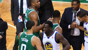 BOSTON, MA - NOVEMBER 16: Jayson Tatum #0 of the Boston Celtics shares a moment after the game against the Golden State Warriors with Draymond Green #23 on November 16, 2017 at the TD Garden in Boston, Massachusetts. NOTE TO USER: User expressly acknowledges and agrees that, by downloading and or using this photograph, User is consenting to the terms and conditions of the Getty Images License Agreement. Mandatory Copyright Notice: Copyright 2017 NBAE (Photo by Jesse D. Garrabrant/NBAE via Getty Images)