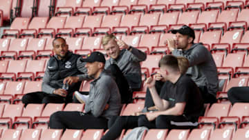 SOUTHAMPTON, ENGLAND - AUGUST 04: James Ward-Prowse of Southampton in the stands with Theo Walcott, Jan Bednarek and Alex McCarthy during a pre-season friendly between Southampton FC and Levante UD at St Mary's Stadium on August 04, 2021 in Southampton, England. (Photo by Robin Jones/Getty Images)