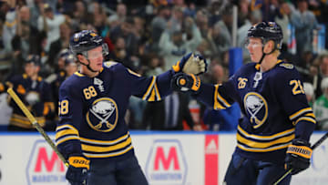 Oct 14, 2019; Buffalo, NY, USA; Buffalo Sabres right wing Victor Olofsson (68) celebrates his goal with defenseman Rasmus Dahlin (26) during the second period against the Dallas Stars at KeyBank Center. Mandatory Credit: Timothy T. Ludwig-USA TODAY Sports