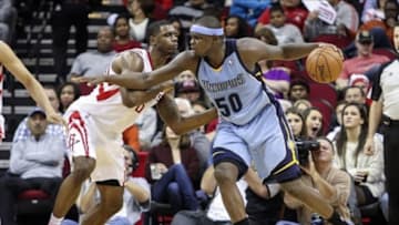 Dec 26, 2013; Houston, TX, USA; Memphis Grizzlies power forward Zach Randolph (50) controls the ball during the second quarter as Houston Rockets power forward Terrence Jones (6) defends at Toyota Center. Mandatory Credit: Troy Taormina-USA TODAY Sports