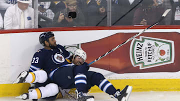 WINNIPEG, MANITOBA - MAY 3: Dustin Byfuglien #33 of the Winnipeg Jets battles Scott Hartnell #17 of the Nashville Predators in Game Four of the Western Conference Second Round during the 2018 NHL Stanley Cup Playoffs on May 3, 2018 at Bell MTS Place in Winnipeg, Manitoba, Canada. (Photo by Jason Halstead /Getty Images)