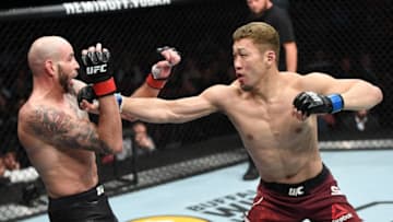 SUNRISE, FL - APRIL 27: (R-L) Takashi Sato of Japan punches Ben Saunders in their welterweight bout during the UFC Fight Night event at BB&T Center on April 27, 2019 in Sunrise, Florida. (Photo by Jeff Bottari/Zuffa LLC/Zuffa LLC via Getty Images)
