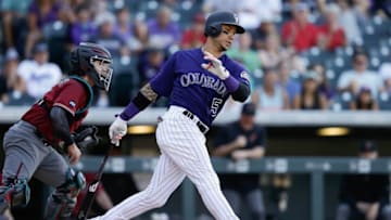 Sep 4, 2016; Denver, CO, USA; Colorado Rockies right fielder Carlos Gonzalez (5) strikes out in the ninth inning to end the game against the Arizona Diamondbacks at Coors Field. The Diamondbacks defeated the Rockies 8-5. Mandatory Credit: Isaiah J. Downing-USA TODAY Sports