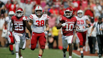 OU safety Pat Fields (10) returns a blocked extra-point attempt for two points during the Sooners' 23-16 win against Nebraska on Saturday at Gaylord Family-Oklahoma Memorial Stadium in Norman.cover main -- ou-nebraska