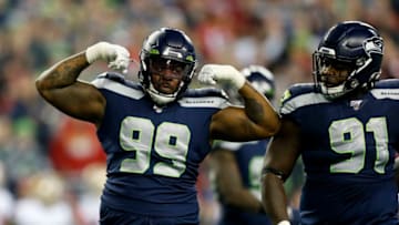 SEATTLE, WASHINGTON - DECEMBER 29: Defensive tackle Quinton Jefferson #99 of the Seattle Seahawks celebrates sacking quarterback Jimmy Garoppolo #10 (not pictured) of the San Francisco 49ers during the first quarter of the game at CenturyLink Field on December 29, 2019 in Seattle, Washington. (Photo by Otto Greule Jr/Getty Images)