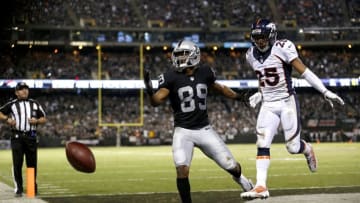 Nov 6, 2016; Oakland, CA, USA; Denver Broncos cornerback Chris Harris Jr. (25) is called for pass interference on a pass intended for Oakland Raiders wide receiver Amari Cooper (89) in the fourth quarter at Oakland Coliseum. The Raiders defeated the Broncos 30-20. Mandatory Credit: Cary Edmondson-USA TODAY Sports