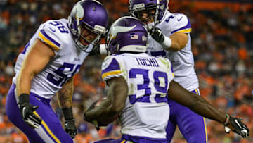 DENVER, CO - AUGUST 11: Linebacker Brett Taylor #45 and linebacker Garret Dooley #58 of the Minnesota Vikings congratulate cornerback Jack Tocho #39 after a fourth quarter interception against the Denver Broncos during an NFL preseason game at Broncos Stadium at Mile High on August 11, 2018 in Denver, Colorado. (Photo by Dustin Bradford/Getty Images)