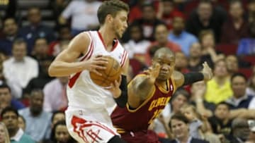 Mar 22, 2013; Houston, TX, USA; Houston Rockets small forward Chandler Parsons (25) is guarded by Cleveland Cavaliers power forward Marreese Speights (15) in the second quarter at the Toyota Center. Mandatory Credit: Brett Davis-USA TODAY Sports