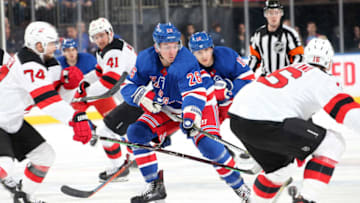 NEW YORK, NY - MARCH 09: Jimmy Vesey #26 of the New York Rangers skates against Steven Santini #16 of the New Jersey Devils at Madison Square Garden on March 9, 2019 in New York City. (Photo by Jared Silber/NHLI via Getty Images)