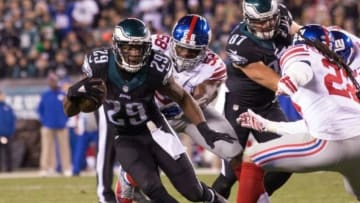 Oct 19, 2015; Philadelphia, PA, USA; Philadelphia Eagles running back DeMarco Murray (29) breaks the tackle attempt of New York Giants defensive end Owamagbe Odighizuwa (58) and rushes for a 12 yard touchdown during the third quarter at Lincoln Financial Field. Mandatory Credit: Bill Streicher-USA TODAY Sports