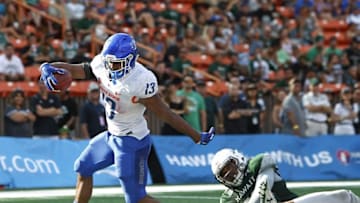 Nov 12, 2016; Honolulu, HI, USA; Boise State Broncos running back Jeremy McNichols (13) makes a touchdown over Hawaii Warriors linebacker Malachi Mageo (38) and linebacker Solomon Matautia (27) during the second quarter of the college football game at Aloha Stadium. Mandatory Credit: Marco Garcia-USA TODAY Sports