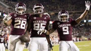 Oct 31, 2020; College Station, TX, USA; Texas A&M tight end Jalen Wydermyer (85) reacts with teammates Isaiah Spiller (28) and Hezekiah Jones (9) after a touchdown catch against Arkansas during the second half of an NCAA college football game, Saturday, Oct. 31, 2020, in College Station, Texas. Mandatory Credit: Sam Craft/Pool Photo-USA TODAY Sports