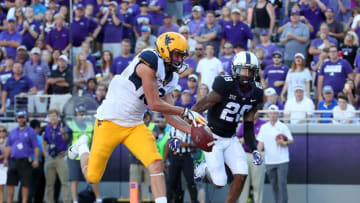 FORT WORTH, TX - OCTOBER 07: David Sills V #13 of the West Virginia Mountaineers pulls in a pass for a touchdown against Tony James #28 of the TCU Horned Frogs in the second half at Amon G. Carter Stadium on October 7, 2017 in Fort Worth, Texas. (Photo by Tom Pennington/Getty Images)