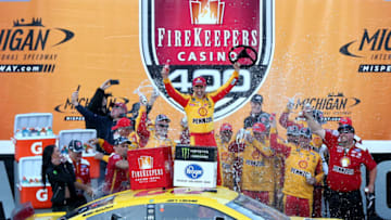 BROOKLYN, MICHIGAN - JUNE 10: Joey Logano, driver of the #22 Shell Pennzoil Ford, celebrates in Victory Lane after winning the Monster Energy NASCAR Cup Series FireKeepers Casino 400 at Michigan International Speedway on June 10, 2019 in Brooklyn, Michigan. (Photo by Matt Sullivan/Getty Images)