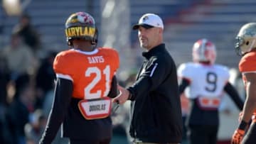 Jan 28, 2016; Mobile, AL, USA; South squad head coach Gus Bradley of the Jacksonville Jaguars talks with safety Sean Davis of Maryland (21) following a play during Senior Bowl practice at Ladd-Peebles Stadium. Mandatory Credit: Glenn Andrews-USA TODAY Sports
