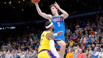 OKC Thunder guard Josh Giddey (3) passes the ball over Los Angeles Lakers forward Carmelo Anthony (7) : Alonzo Adams-USA TODAY Sports