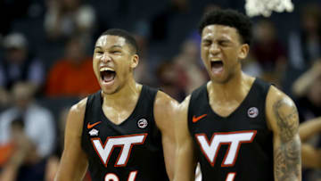 CHARLOTTE, NORTH CAROLINA - MARCH 14: Teammates Kerry Blackshear Jr. #24 and Nickeil Alexander-Walker #4 of the Virginia Tech Hokies react against the Florida State Seminoles during their game in the quarterfinal round of the 2019 Men's ACC Basketball Tournament at Spectrum Center on March 14, 2019 in Charlotte, North Carolina. (Photo by Streeter Lecka/Getty Images)
