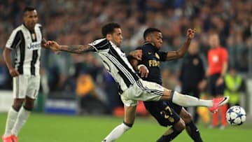 TURIN, ITALY - MAY 09: Dani Alves of Juventus and Thomas Lemar of AS Monaco in action during the UEFA Champions League Semi Final second leg match between Juventus and AS Monaco at Juventus Stadium on May 9, 2017 in Turin, Italy. (Photo by Richard Heathcote/Getty Images)
