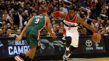 Nov 1, 2014; Washington, DC, USA; Washington Wizards guard John Wall (2) dribbles the ball past Milwaukee Bucks guard Jared Dudley (9) in the first quarter at Verizon Center. The Wizards won 108-97. Mandatory Credit: Geoff Burke-USA TODAY Sports