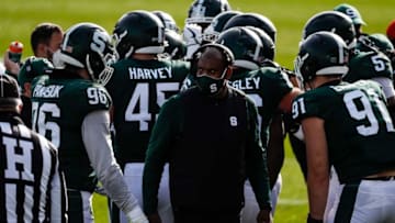 Michigan State coach Mel Tucker talks to players during a timeout during the first half against Indiana at Spartan Stadium in East Lansing, Saturday, Nov. 14, 2020.
