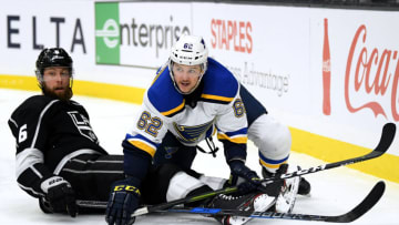 LOS ANGELES, CALIFORNIA - JANUARY 21: Mackenzie MacEachern #62 of the St. Louis Blues and Jake Muzzin #6 of the Los Angeles Kings watch play from the ice during the third period in a 4-3 Kings win at Staples Center on January 21, 2019 in Los Angeles, California. (Photo by Harry How/Getty Images)