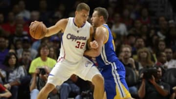 Oct 7, 2014; Los Angeles, CA, USA; Los Angeles Clippers forward Blake Griffin (32) posts up on Golden State Warriors forward David Lee (10) during the first quarter at Staples Center. Mandatory Credit: Kelvin Kuo-USA TODAY Sports
