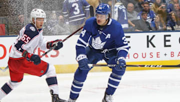 TORONTO, ON - OCTOBER 21: Markus Nutivaara #65 of the Columbus Blue Jackets skates against Auston Matthews #34 of the Toronto Maple Leafs during an NHL game at Scotiabank Arena on October 21, 2019 in Toronto, Ontario, Canada. The Blue Jackets defeated the Maple Leafs 4-3 in overtime. (Photo by Claus Andersen/Getty Images)