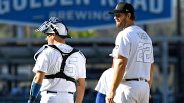 LOS ANGELES, CA - AUGUST 25: Clayton Kershaw #22 and Austin Barnes #15 of the Los Angeles Dodgers react on the mound after a solo home run by Aaron Judge #99 of the New York Yankees in the third inning at Dodger Stadium on August 25, 2019 in Los Angeles, California. Teams are wearing special color schemed uniforms with players choosing nicknames to display for Players' Weekend. (Photo by Jayne Kamin-Oncea/Getty Images)