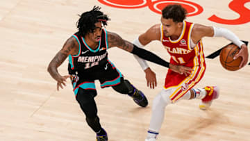 Apr 7, 2021; Atlanta, Georgia, USA; Memphis Grizzlies guard Ja Morant (12) defends Atlanta Hawks guard Trae Young (11) during the second half at State Farm Arena. Mandatory Credit: Dale Zanine-USA TODAY Sports