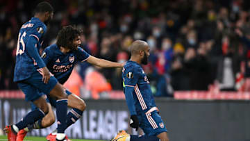 LONDON, ENGLAND - DECEMBER 03: Alexandre Lacazette of Arsenal celebrates with Mohamed Elneny and Ainsley Maitland-Niles after scoring their team's first goal during the UEFA Europa League Group B stage match between Arsenal FC and Rapid Wien at Emirates Stadium on December 03, 2020 in London, England. A limited number of fans are welcomed back to stadiums to watch elite football across England. This was following easing of restrictions on spectators in tiers one and two areas only. (Photo by Mike Hewitt/Getty Images)