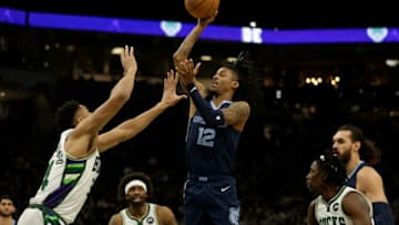 MILWAUKEE, WISCONSIN - JANUARY 19: Ja Morant #12 of the Memphis Grizzlies attempts to shoot over Giannis Antetokounmpo #34 of the Milwaukee Bucks during the first half at Fiserv Forum on January 19, 2022 in Milwaukee, Wisconsin. NOTE TO USER: User expressly acknowledges and agrees that, by downloading and or using this photograph, User is consenting to the terms and conditions of the Getty Images License Agreement. (Photo by John Fisher/Getty Images)