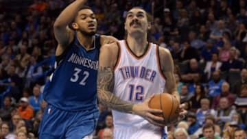Jan 15, 2016; Oklahoma City, OK, USA; Oklahoma City Thunder center Steven Adams (12) drives to the basket in front of Minnesota Timberwolves center Karl-Anthony Towns (32) during the fourth quarter at Chesapeake Energy Arena. Mandatory Credit: Mark D. Smith-USA TODAY Sports