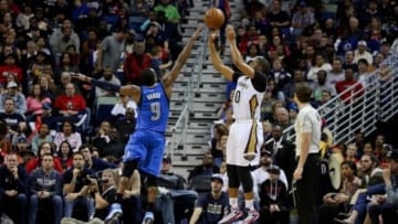 Jan 25, 2015; New Orleans, LA, USA; New Orleans Pelicans guard Eric Gordon (10) shoots over Dallas Mavericks guard Rajon Rondo (9) during the fourth quarter of a game at the Smoothie King Center. The Pelicans defeated the Mavericks 109-106. Mandatory Credit: Derick E. Hingle-USA TODAY Sports