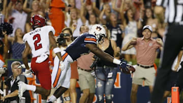 Sep 10, 2016; Auburn, AL, USA; Auburn Tigers running back Kerryon Johnson (21) dives for the end zone as Arkansas State Red Wolves cornerback Nehemiah Wagner (2) defends during the first quarter at Jordan Hare Stadium. Mandatory Credit: John Reed-USA TODAY Sports