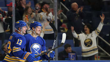 Oct 25, 2021; Buffalo, New York, USA; Buffalo Sabres defenseman Robert Hagg (8) celebrates his goal with defenseman Mark Pysyk (13) during the third period against the Tampa Bay Lightning at KeyBank Center. Mandatory Credit: Timothy T. Ludwig-USA TODAY Sports