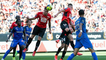 Rennes' French forward Flavien Tait (C) heads the ball during the French L1 football match between Stade Rennais FC and Stade de Reims at The Roazhon Park Stadium in Rennes, western France on September 12, 2021. (Photo by LOIC VENANCE / AFP) (Photo by LOIC VENANCE/AFP via Getty Images)