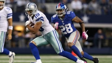 Oct 28, 2012; Arlington, TX, USA; Dallas Cowboys receiver Miles Austin (19) runs after a catch against New York Giants cornerback Jayron Hosley (28) at Cowboys Stadium. Mandatory Credit: Matthew Emmons-USA TODAY Sports