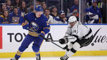 Mar 6, 2022; Buffalo, New York, USA; Los Angeles Kings center Anze Kopitar (11) tries to block a pass by Buffalo Sabres defenseman Rasmus Dahlin (26) during the third period at KeyBank Center. Mandatory Credit: Timothy T. Ludwig-USA TODAY Sports