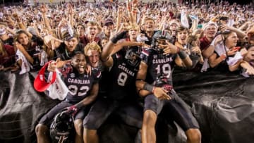 Oct 29, 2016; Columbia, SC, USA; South Carolina Gamecocks running back Rod Talley (32) and South Carolina Gamecocks wide receiver Randrecous Davis (8) and South Carolina Gamecocks wide receiver Lorenzo Nunez (19) celebrate with students following their 24-21win over the Tennessee Volunteers at Williams-Brice Stadium. Mandatory Credit: Jeff Blake-USA TODAY Sports