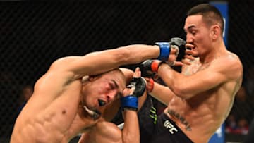 DETROIT, MI - DECEMBER 02: (R-L) Max Holloway lands a knee against Jose Aldo of Brazil in their UFC featherweight championship bout during the UFC 218 event inside Little Caesars Arena on December 02, 2017 in Detroit, Michigan. (Photo by Josh Hedges/Zuffa LLC/Zuffa LLC via Getty Images)