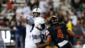 Sep 27, 2019; College Park, MD, USA; Penn State Nittany Lions quarterback Sean Clifford (14) passes the ball as Maryland Terrapins linebacker Keandre Jones (4) defends in the third quarter at Capital One Field at Maryland Stadium. Mandatory Credit: Geoff Burke-USA TODAY Sports