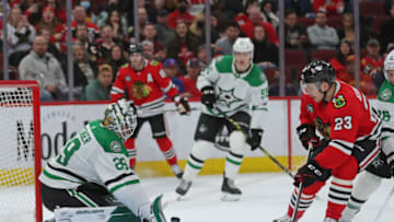 Apr 10, 2022; Chicago, Illinois, USA;Dallas Stars goaltender Jake Oettinger (29) makes a save on a shot from Chicago Blackhawks center Philipp Kurashev (23) during the third period at the United Center. Mandatory Credit: Dennis Wierzbicki-USA TODAY Sports